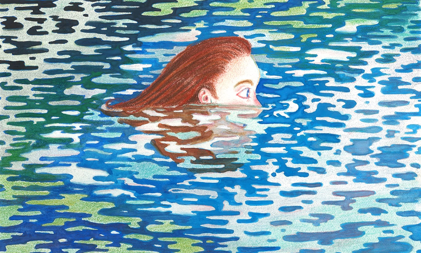 Female head submerged in body of water swimming among reflections