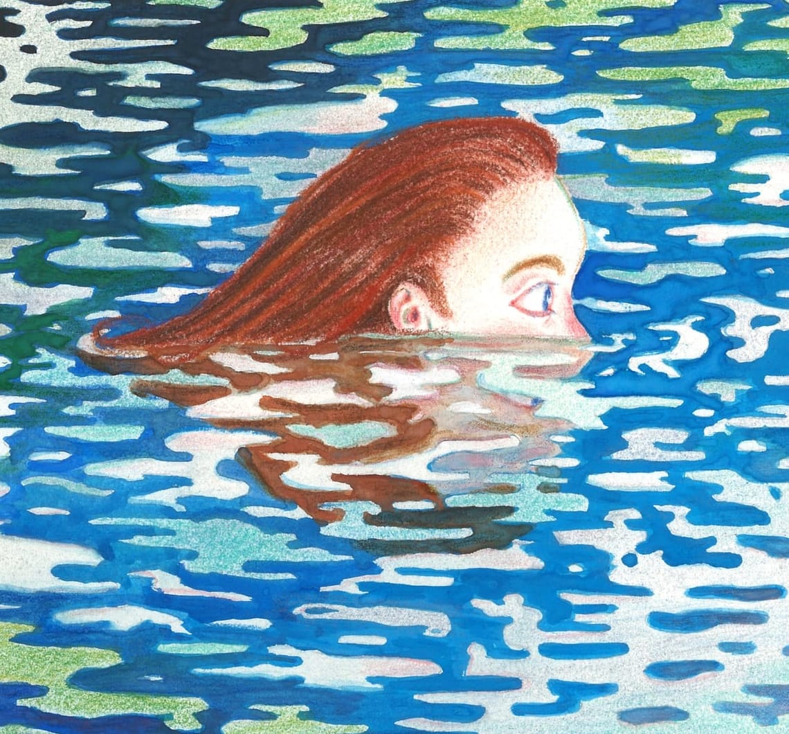 Female head submerged in body of water swimming among reflections